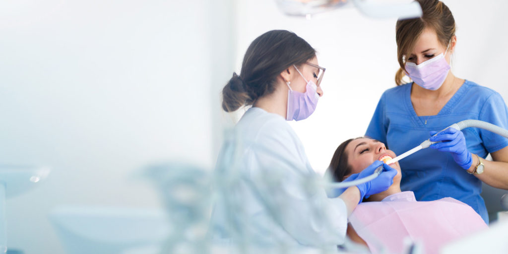 dentist performing dental procedure