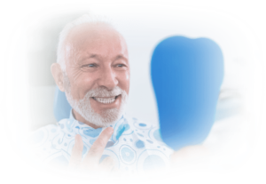 Happy Senior Man Admiring New Dentures In Mirror