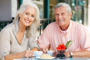 Dental Implant Patients Eating Together With Their False Teeth in Phoenix, AZ