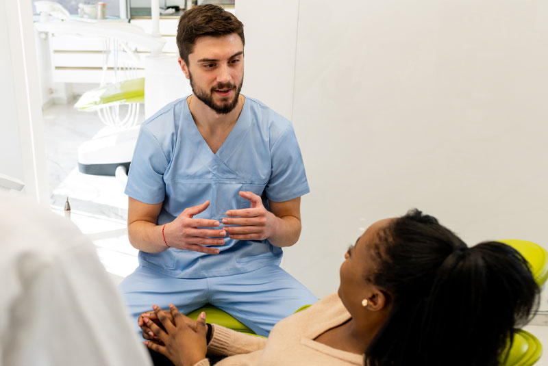 dentist talking to dental patient