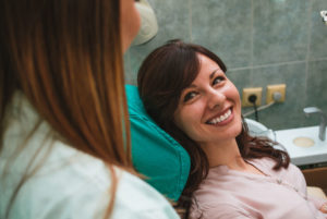 Dental Patient Smiling After Getting A Full Arch Dental Implant